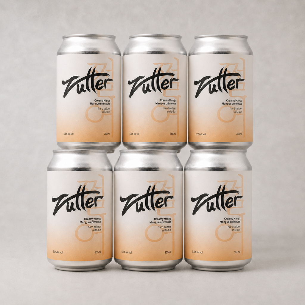 Zutter Creamy Mango hard seltzer 6-pack in the original stacked arrangement